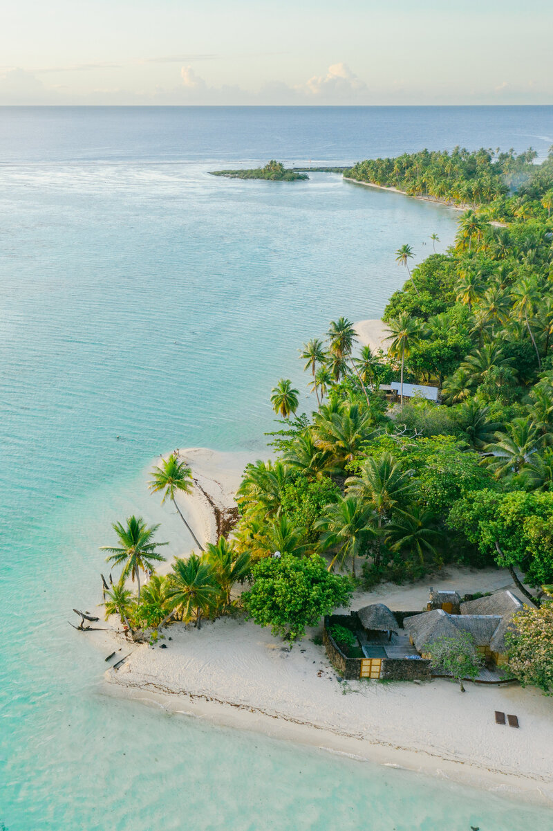 Aerial view on Tahaa lagoon at sunset with nice blue and green colors