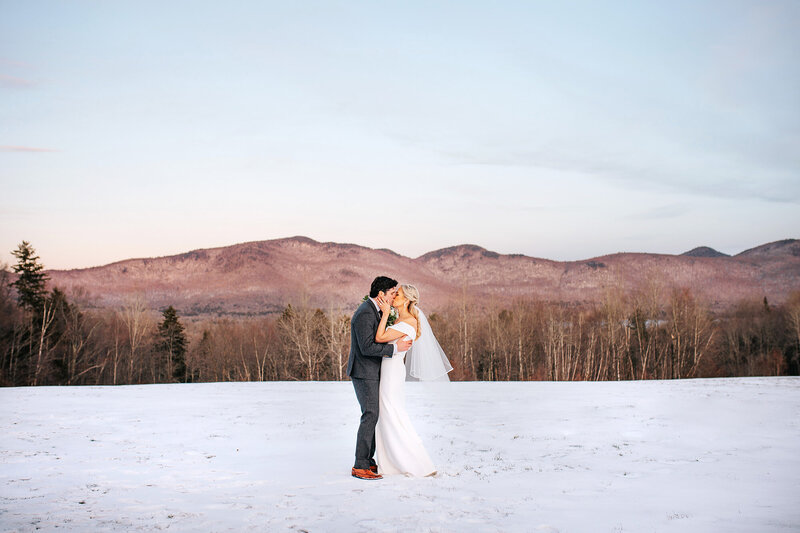 photographer with couple on summit of killington mountain vermont wedding