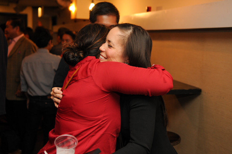 Gina Ortiz Jones Texas congressional candidate hugging voter