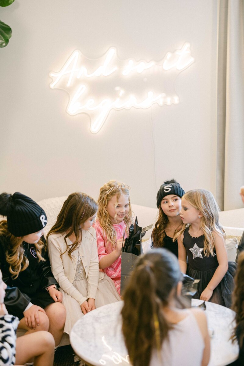 A group of young girls celebrates their friend's birthday at Hart and Main
