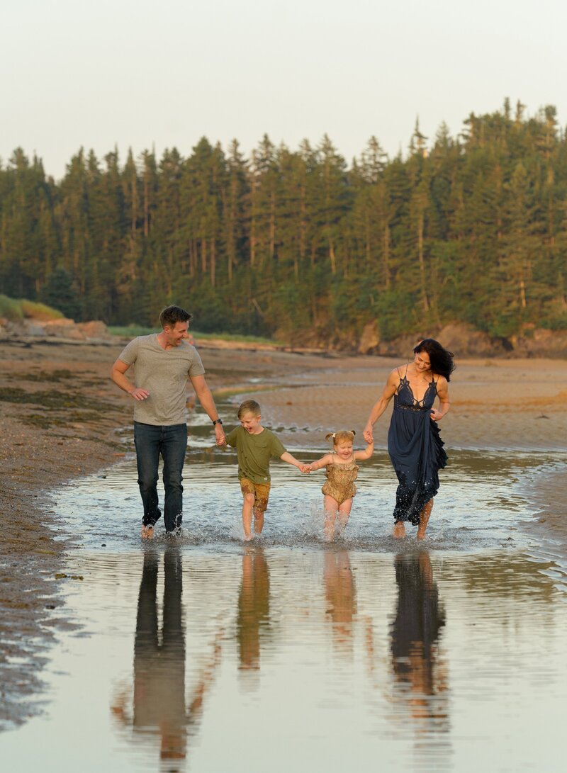 family playing together at a photo session at New River Beach