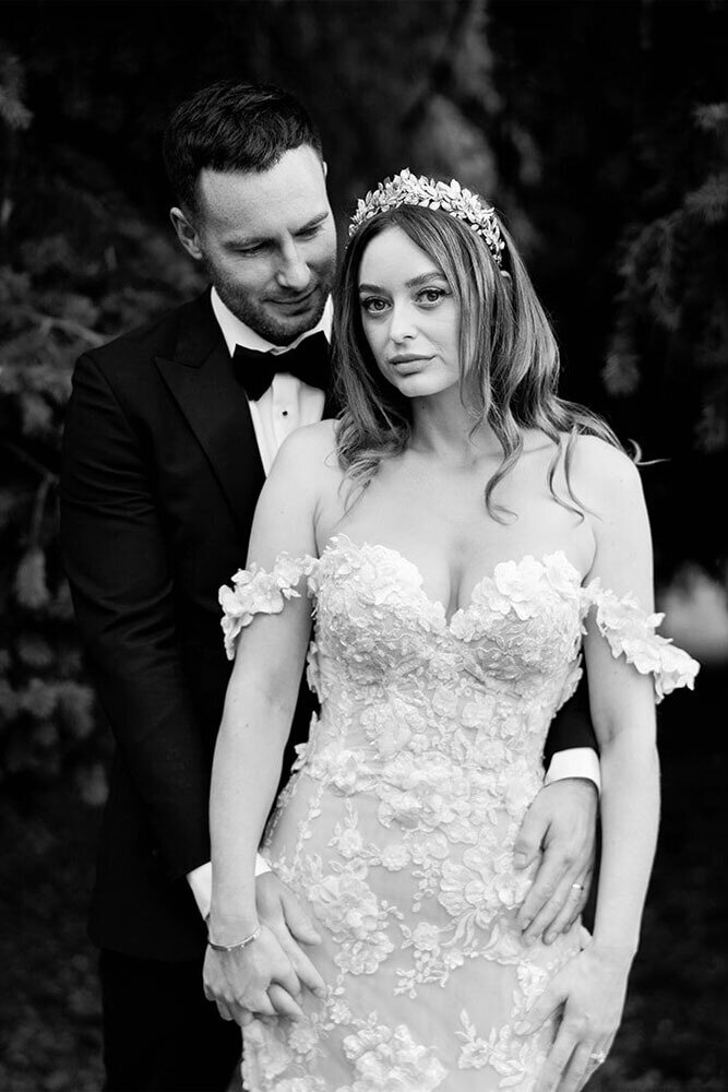 black and white portrait wedding photo of bride and groom looking to camera taken in cheshire