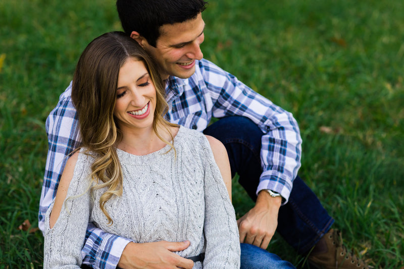 Maine Engagement Shoot with a laughing and intimate couple outdoors in the fall in a field in New Hampshire outdoors