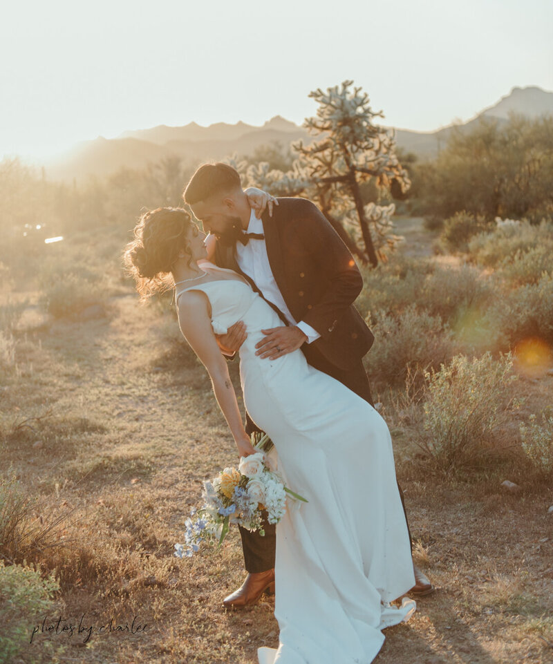 a bride and groom hugging on their wedding day in arizona