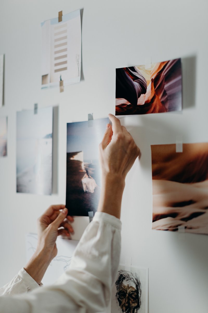 photo-of-person-putting-photo-on-wall-3585033