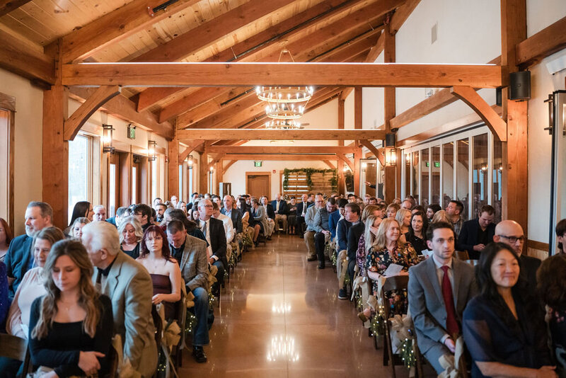rustic barn indoor wedding ceremony at barnwood events in madison, winconsin.