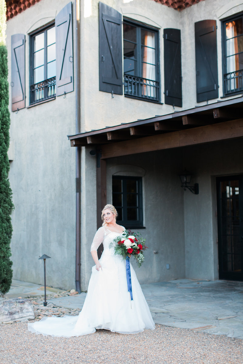Bride in front of Venue Photo