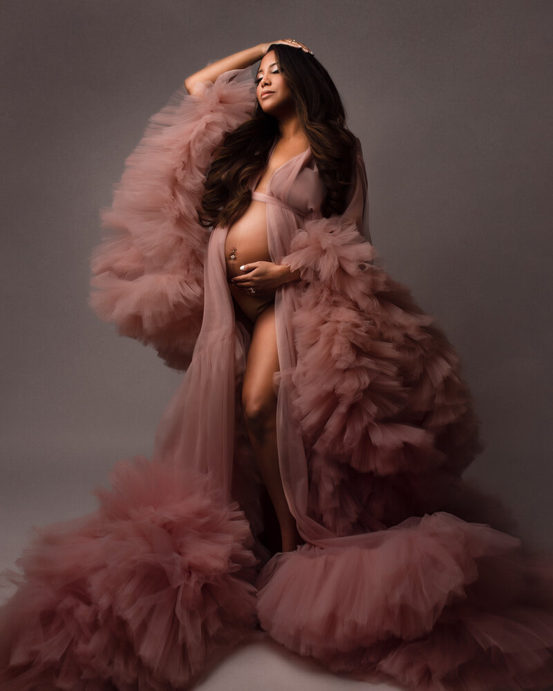 Edmomton maternity photographer with client in pink gown