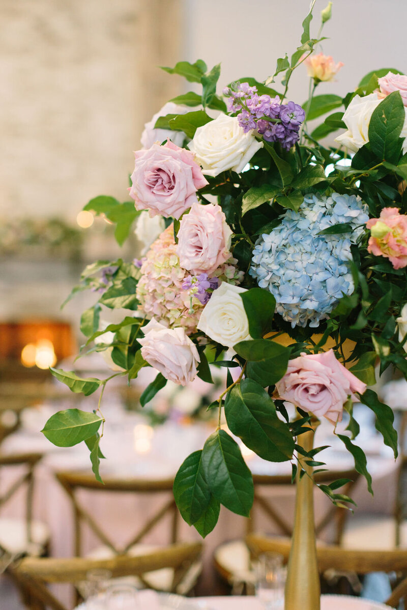 Floral centerpiece with pink and blue flowers