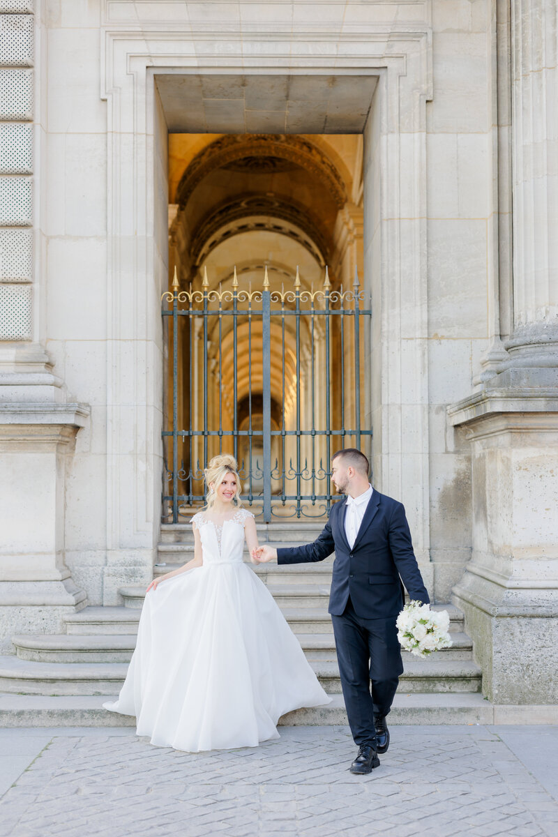 Light and bright wedding photography in central Paris at the Louvre.
