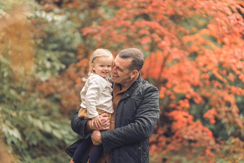 dad and daughter in the autumn leaves