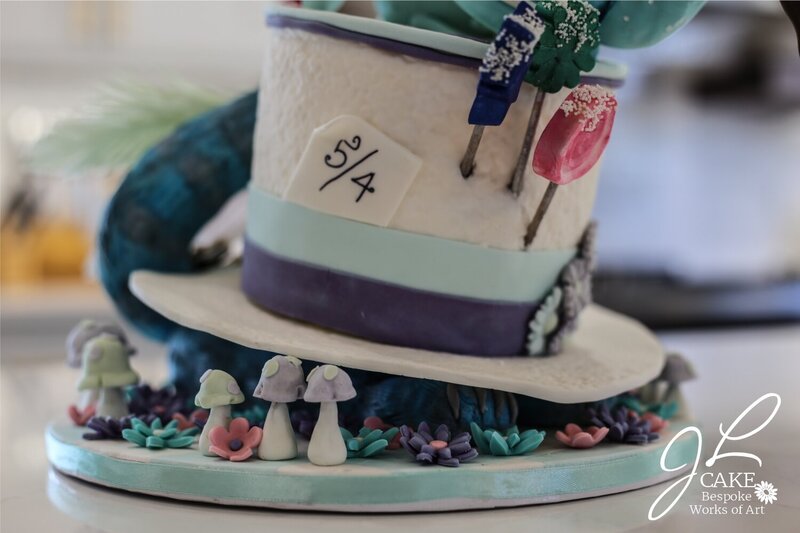 spilling teapot cake, cheshire cat cake, mad hatter cake