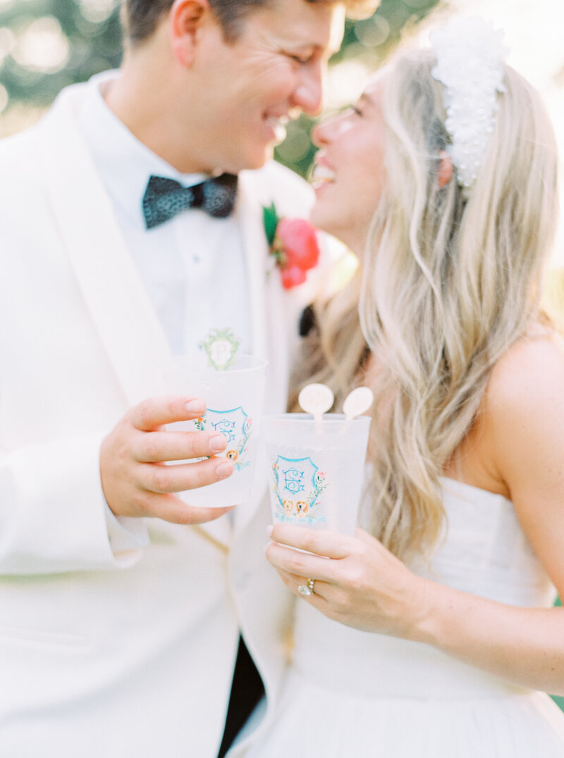 Custom plastic cups for wedding reception. Include your dog in your wedding. Groom in brackish bowtie.