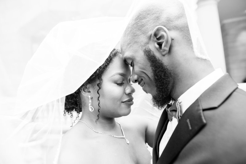 Black couple under the veil at their wedding at the Wimbish House in Atlanta Georgia by Jennifer Marie Studios, Atlanta light and airy wedding photographer.