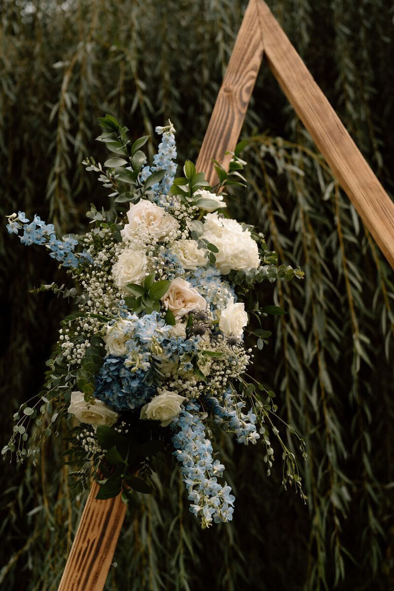 Ceremony arch a-frame  blue white outdoor wedding flowers rustic boho bride