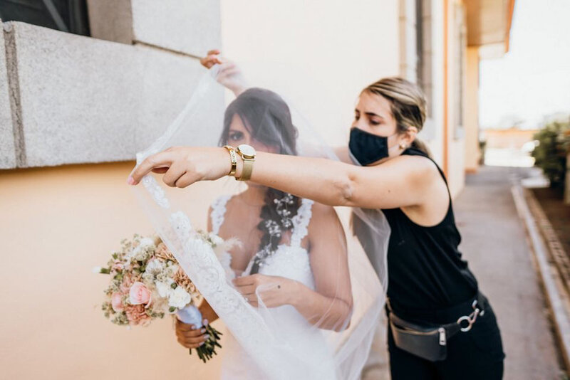 Cristina Salazar, a Costa Rican wedding planner helping a bride with her veil