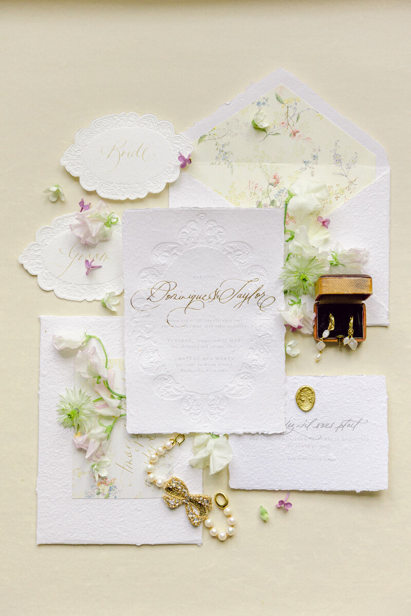 Fine art wedding flat lay with vintage invitation handwriting jewelry envelope-9
