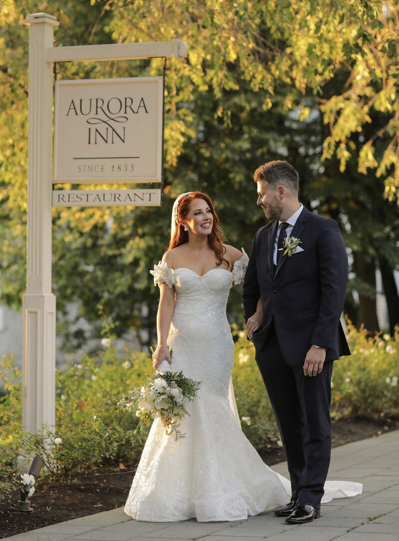 Aurora Inn sign bride and groom