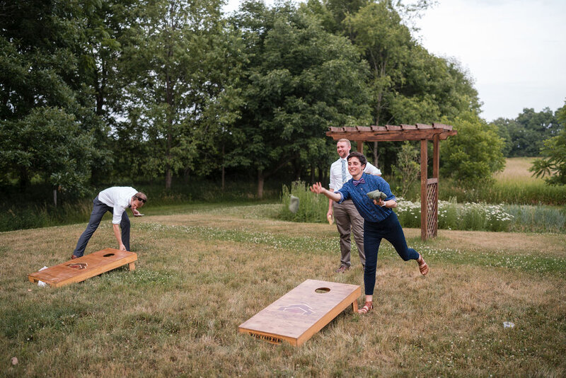 guests playing cornhole at barnwood events in madison, winconsin.