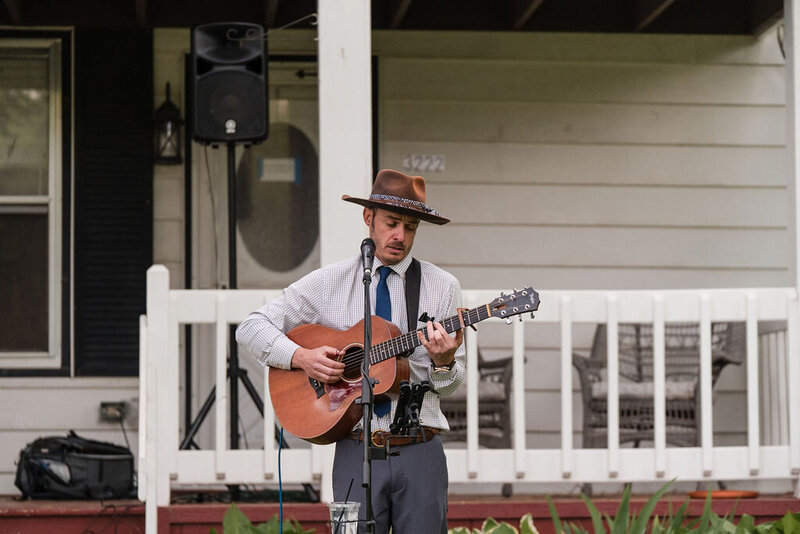 musician playing a guitar at barnwood events in madison, winconsin.