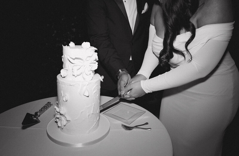 Bride and Groom cutting their wedding cake together