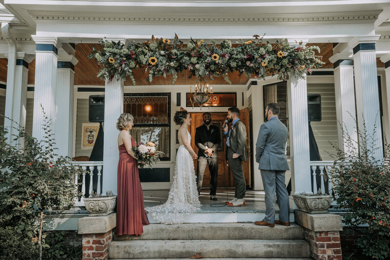 wedding ceremony on large house porch
