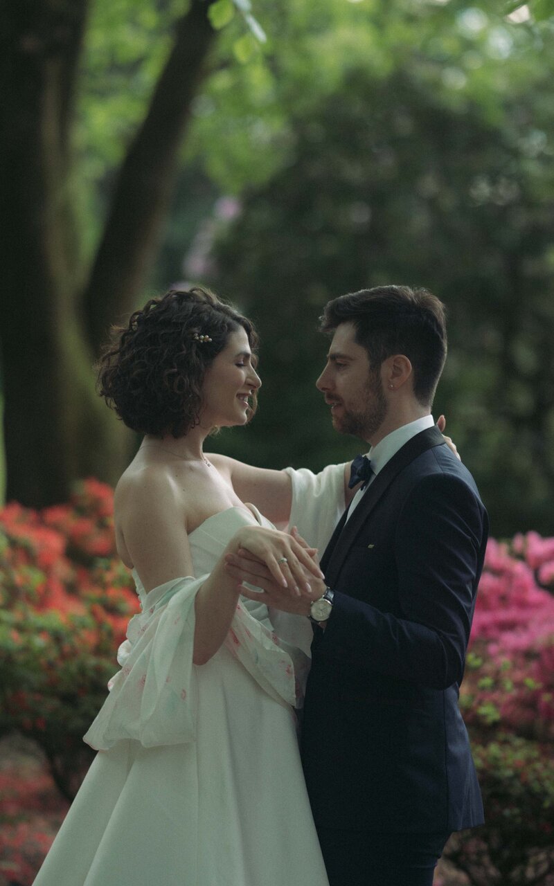 Intimate moment of a couple gazing into each other's eyes, sharing love and connection in a serene, emotional outdoor setting
