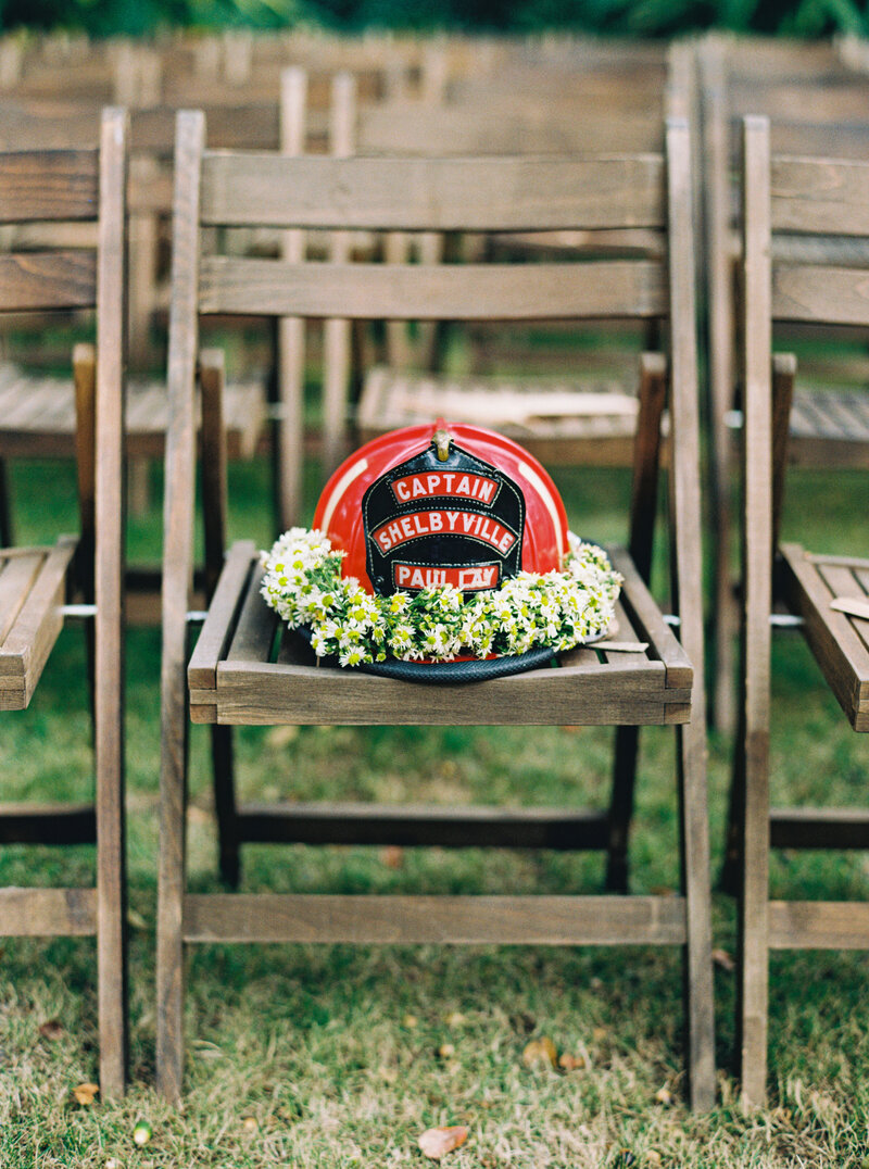 This groom reserved a seat for his firefighter grandfather. Garden wedding ceremony in downtown Charleston.
