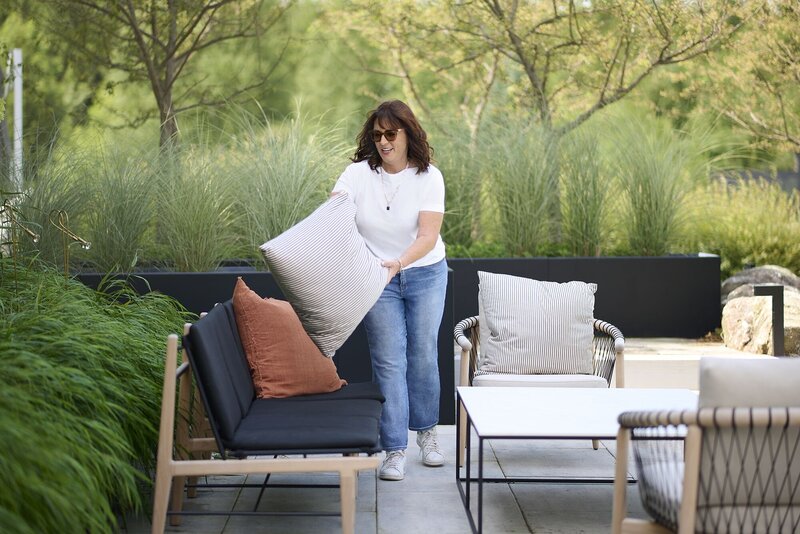 Kimberley Seldon plumping cushions