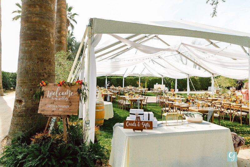 farm tables under a clear top tent in the spring