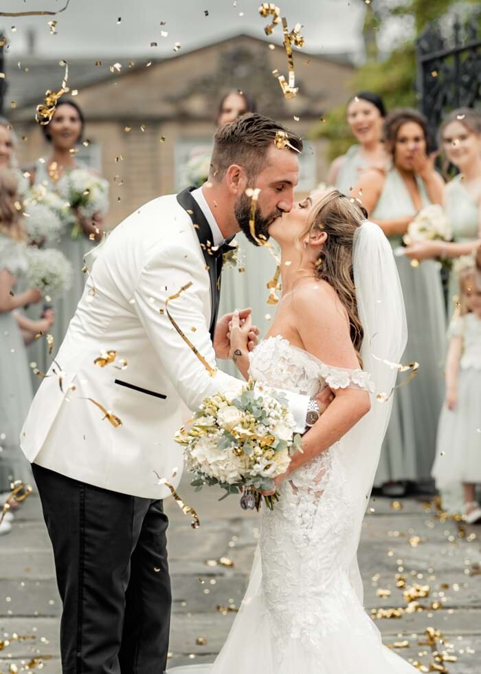Yorkshire Wedding Photographer & Videographer capturing a romantic confetti moment at Waterton Park Hotel and Spa.
