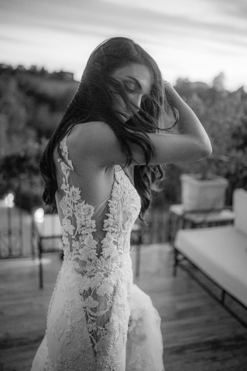 bride fine art picture with hair moved by the wind at la villa hotel terrace
