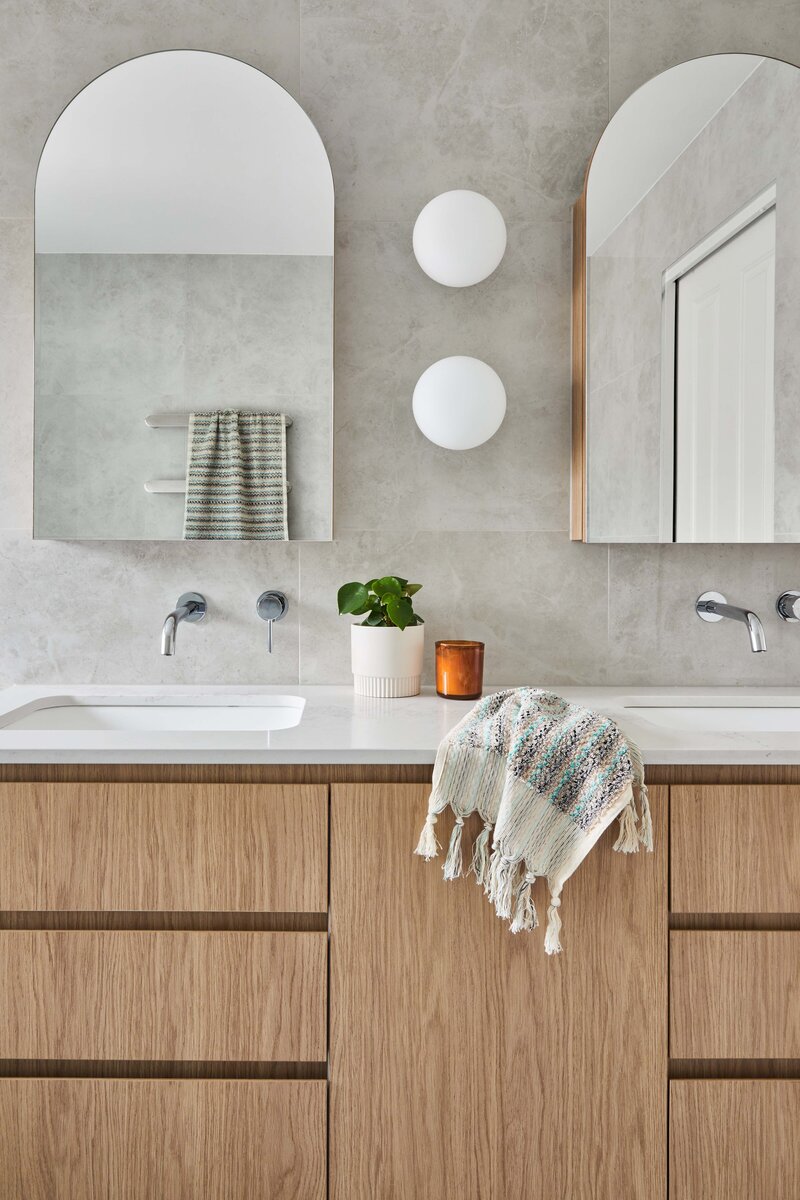 Melbourne interior designer bathroom project with timber vanity, dual sinks, and modern finishes.