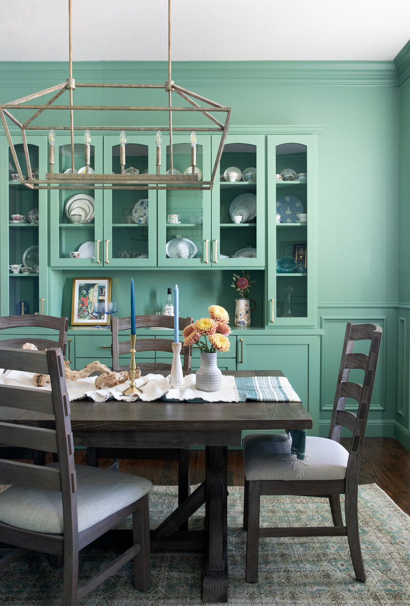 Green cabinetry dining room