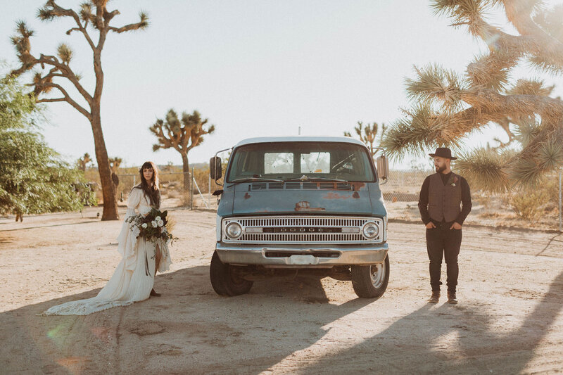bride and groom posing in a desert after elopement