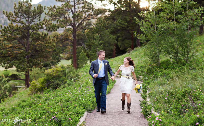 Couple runs along the flat path of Lily Lake in Estes Park Colorado