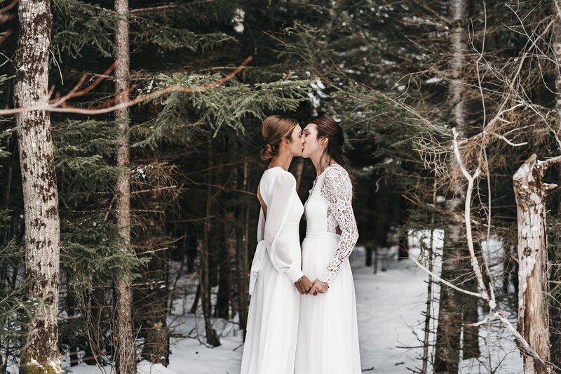 Mckayla and Emily share a kiss during their elopement ceremony.