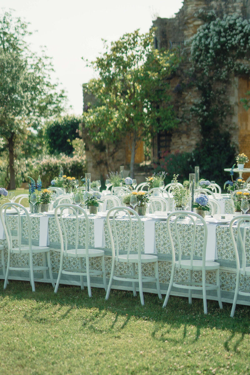 table set up with green and white patterned linen for a summer garden wedding at euridge manor