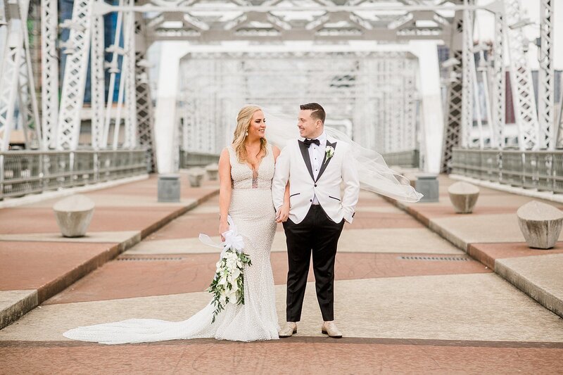 bride and groom on bridge by Knoxville Wedding Photographer, Amanda May Photos
