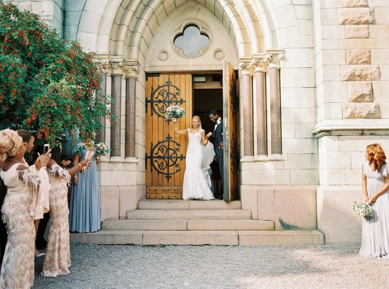 0015_Bride-and-groom-exiting-Oscars-kyrkan-after-the-wedding-ceremony