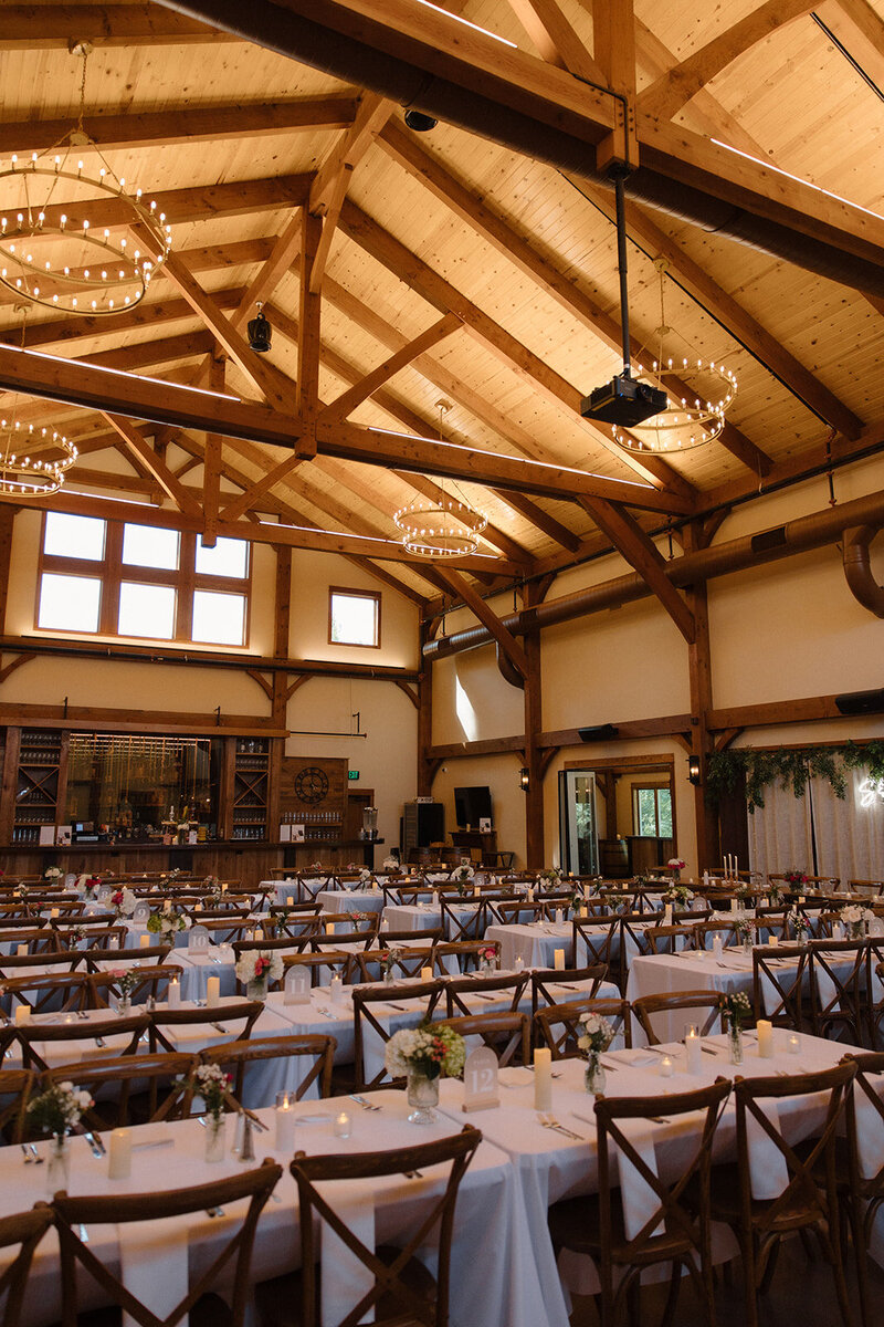 long table settings in the barn at barnwood events in madison, winconsin.