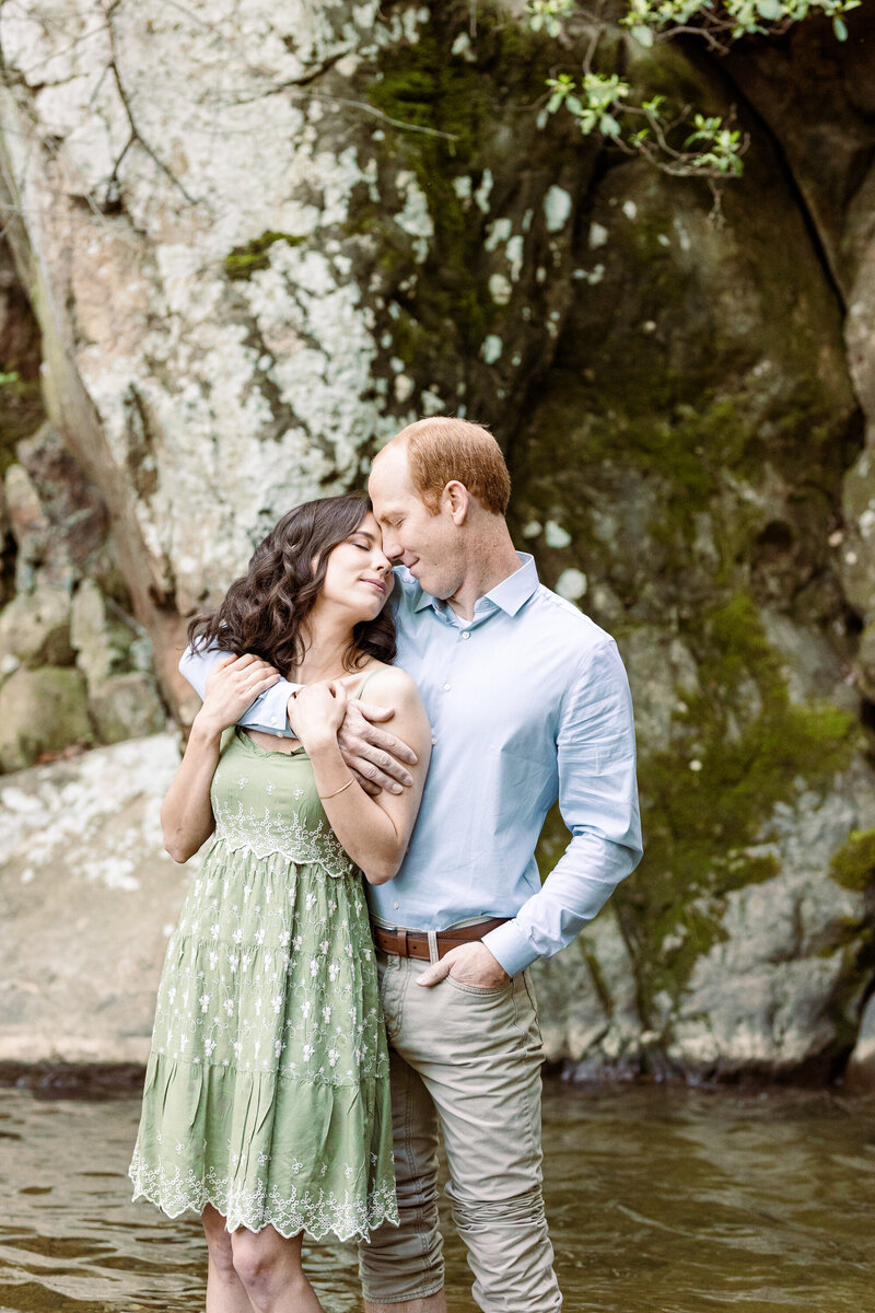 engaged couple posing at Glen Falls
