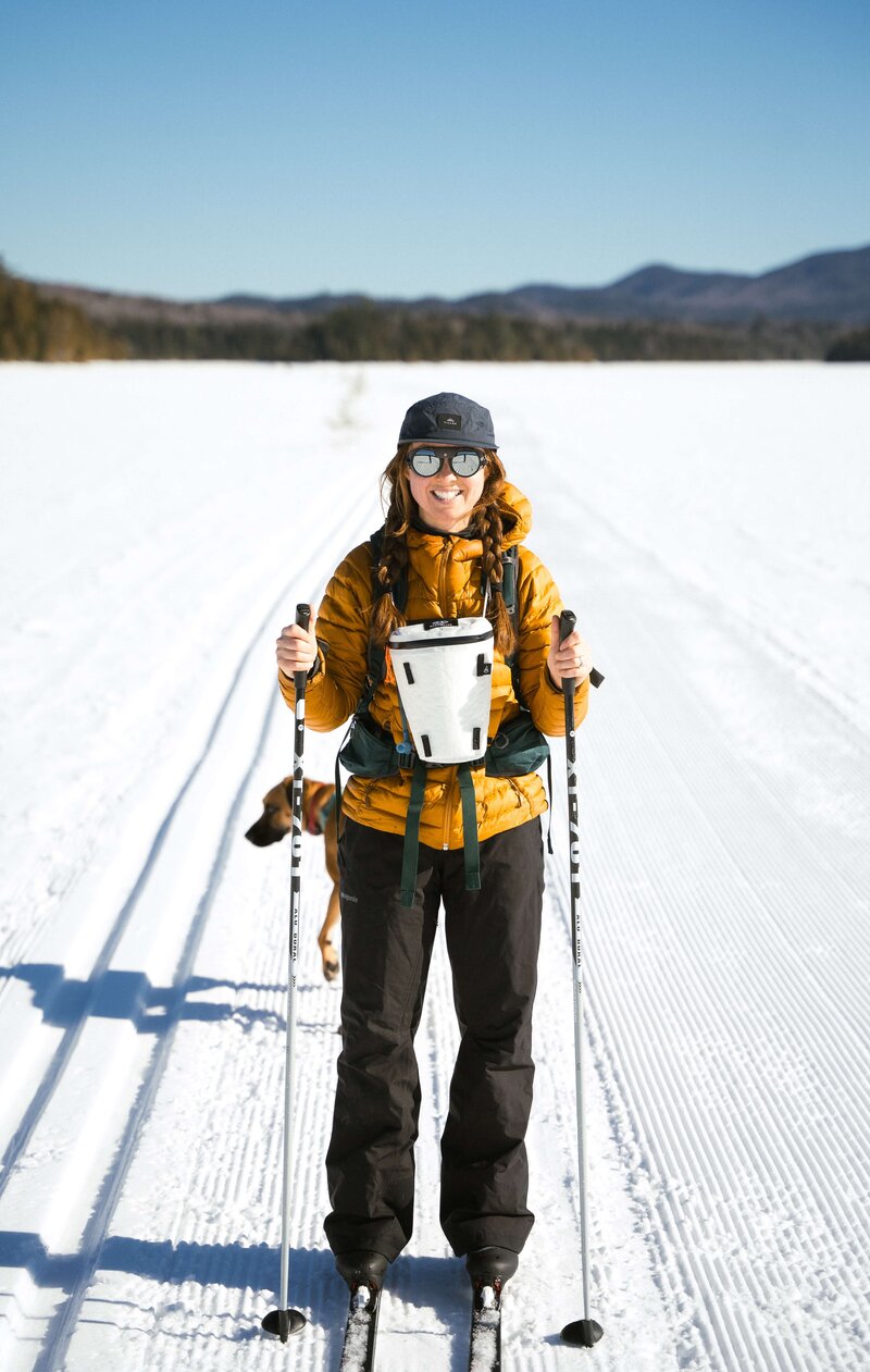 Meredith Ewenson cross country skiing on a frozen lake in the 100 mile wilderness in maine