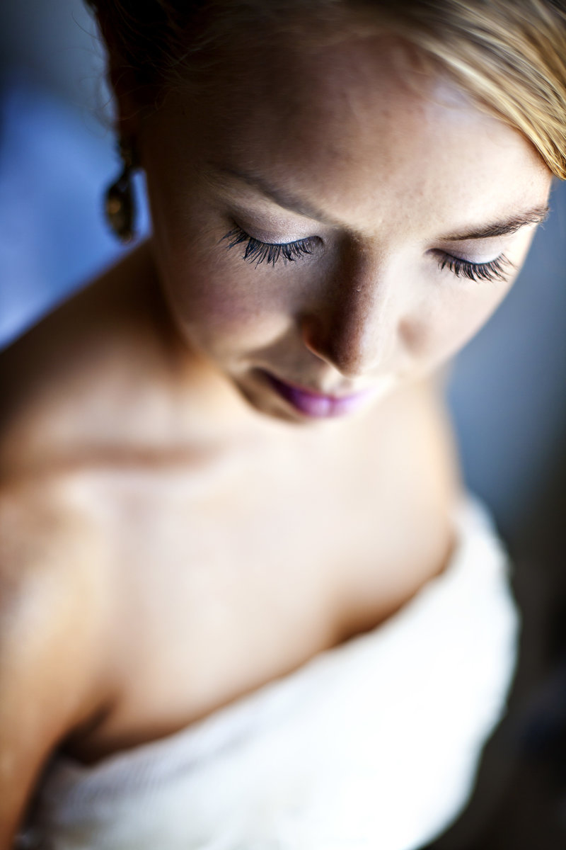 A soft light bridal portrait focusing on her eye lashes.