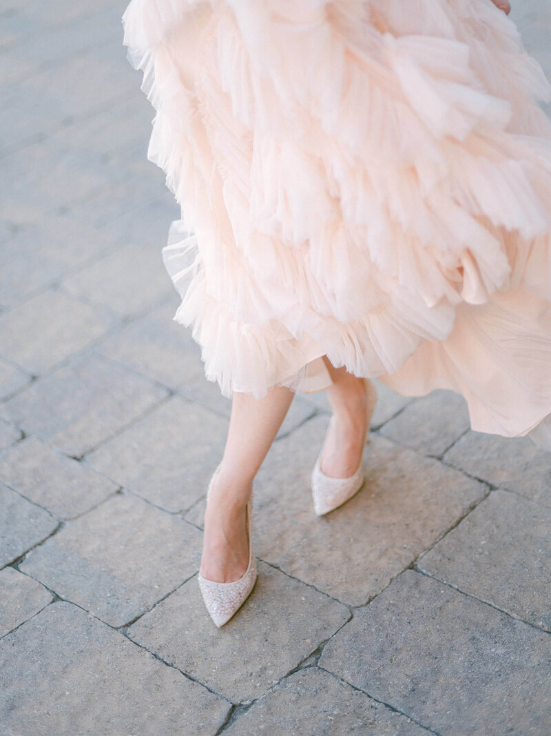 Woman wearing pink dress and shoes