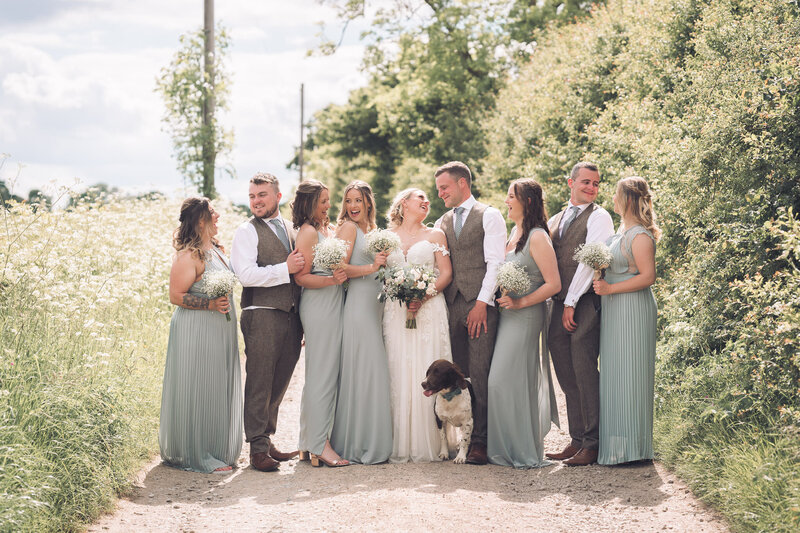 bridal party on gravel road