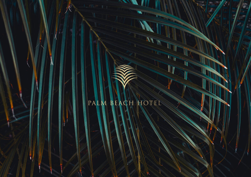 Gold Palm Beach Hotel logo overlaid on photograph of green palm leaves.