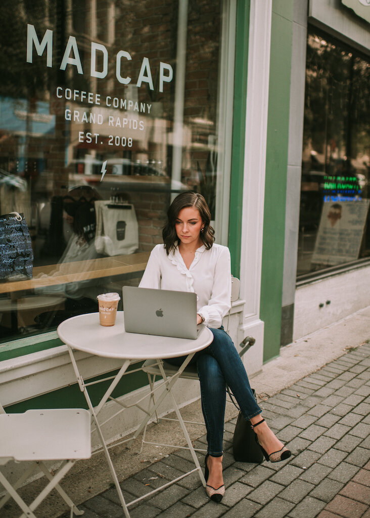 Girl working from her laptop outside