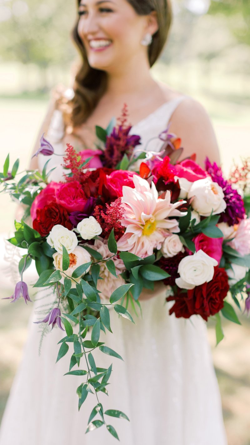Bride with jewel tone flower bouquet