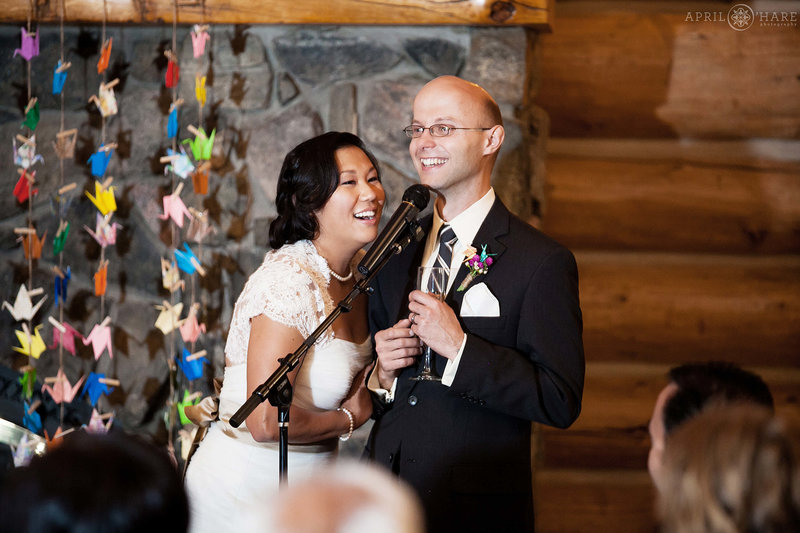 Candid wedding photo inside the Evergreen Lake House in Colorado